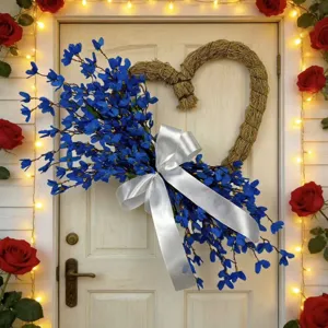 Elegant heart-shaped artificial blue flower wreath with white satin ribbon for door decor