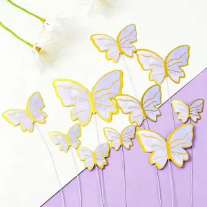 Decorative set of purple gold-stamped butterfly cake toppers for birthday dessert styling