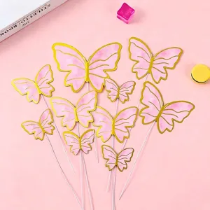Set of pink and gold butterfly cake toppers for birthday party dessert table decoration