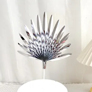 Silver fan cake topper, metallic paper leaf baking decoration for birthday party celebration.