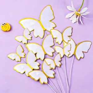 White and gold foil butterfly cake toppers for birthday dessert table decoration