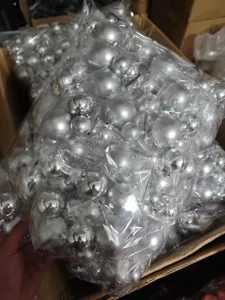Silver decorative plastic balls bulk pack detail shot for cake and party styling supplies.
