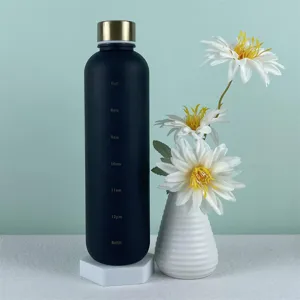 Detailed view of black matte sports water bottle with time markers and golden lid.
