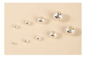 Detailed macro view of S925 sterling silver round spacer beads in various sizes