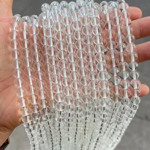 Close-up macro view of clear synthetic white crystal round beads for DIY jewelry