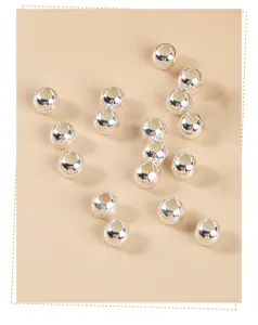 Close-up of S925 sterling silver round spacer beads with high-shine metallic finish