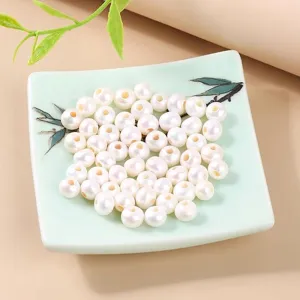 Natuurlijke zoetwaterparels met grote gaten voor DIY-sieraden op een keramisch bordje