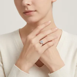 Elegant S925 sterling silver pear-shaped moissanite ring worn on model's finger