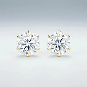 Elegant round-cut moissanite stud earrings with classic six-prong gold-tone setting.