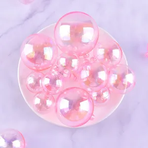 Colorful bubble balls cake toppers, pink iridescent spheres for birthday party decor and baking.