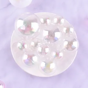 Detailed view of iridescent cake decoration balls, colorful bubble balls for birthday party.