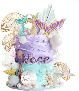 Mermaid cake topper set featuring glitter tails, fan leaves, and birthday sign details.