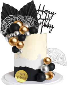 Detail view of black, gold, and silver balloon cake topper set with bohemian style fans.