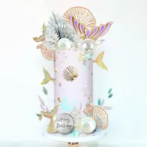 Mermaid cake topper set with mermaid tails, pearl balls, and Happy Birthday sign for party.