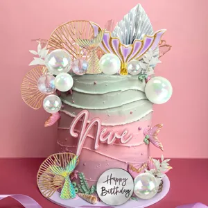 Mermaid birthday cake topper detail, sparkling tail and pearl bubble ball decoration set.