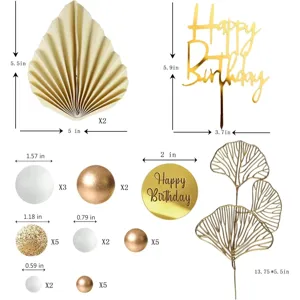 Bohemian cake decoration set featuring happy birthday toppers, gold fans, and ball ornaments.