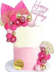 Bohemian birthday cake topper details featuring pink balloons, gold fans, and happy birthday sign.