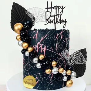 Bohemian black birthday cake topper and decorative ornaments set for party celebration.