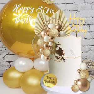 Bohemian birthday cake decoration details with gold white balloons and cake topper props.
