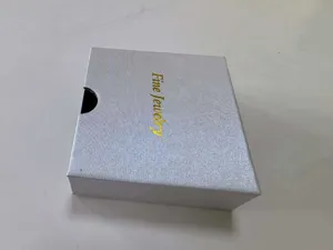Elegant silver textured square jewelry gift box with gold Fine Jewelry printing detail