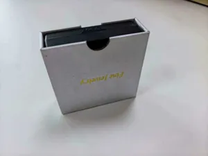 Premium grey jewelry packaging box with gold embossed Fine Jewelry text detail