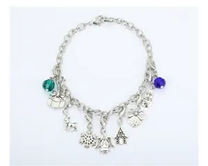 Detailed view of silver Christmas charm bracelet with snowflake and reindeer pendants