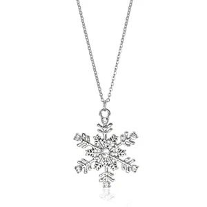 Detailed macro view of a silver snowflake necklace pendant with sparkling rhinestones