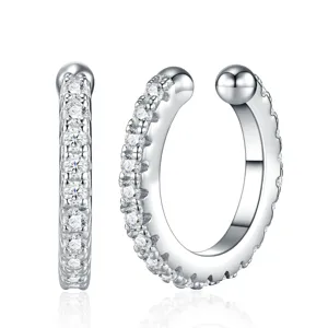 Close-up of S925 silver ear cuffs with pavé-set moissanite stones and metallic finish