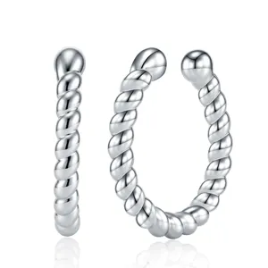 Detailed close-up of minimalist silver-toned twist-designed C-shaped ear cuff jewelry