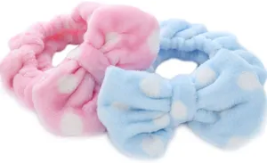 Soft plush bow headband in pink and blue polka dots for daily facial makeup washing.