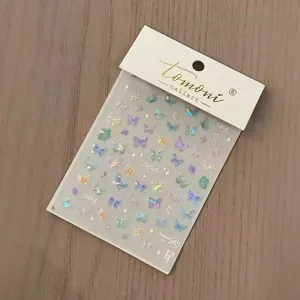 Holographic butterfly nail art stickers, shiny 3D translucent design for elegant manicure decor.