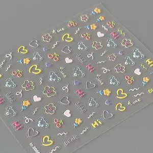 Close-up detail of Korean style cute bear and flower adhesive nail art stickers sheet.
