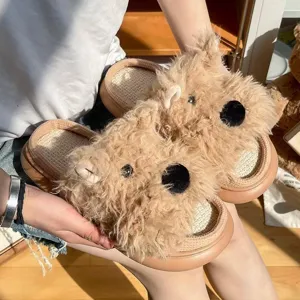 Close-up detail of the cute fluffy plush puppy slippers with comfortable linen insole.
