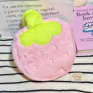 Cute plush strawberry-shaped cosmetic bag with soft pink faux fur and green stem detail