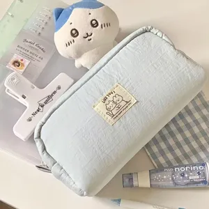 Cute blue canvas pencil pouch with cat label, large capacity aesthetic stationery storage bag detail