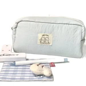 Cute blue pencil pouch with large capacity, cat patch design, ideal student stationery bag.