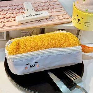 Close-up of creative fried shrimp tempura plush pencil case on lifestyle desk