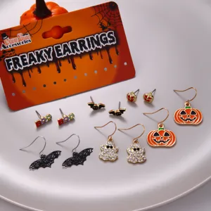 Detailed view of Halloween earring set with rhinestones featuring pumpkin ghost and bat designs