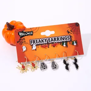 Close-up of Halloween themed earring set featuring ghost, spider and bat designs