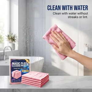 Detail view of pink microfiber cleaning cloth wiping glass, thick and lint-free design.