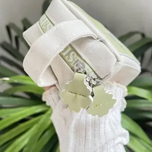 Astuccio verde in tela con cerniera a forma di fiore carino, grande capacità e portatile.