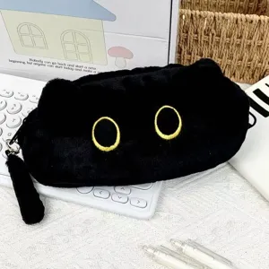 Detail view of a soft plush black cat pencil case with cute yellow embroidered eyes