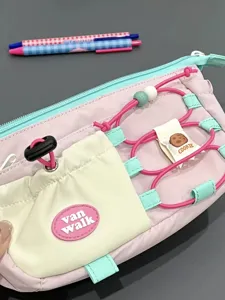 Cute pink pencil case detail, multi-functional storage pouch with elastic cord and cookie tag.