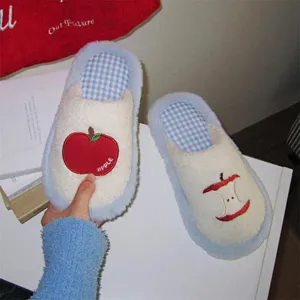 Cute plush fuzzy house slippers with lovely red apple embroidery detail for cozy indoor wear.