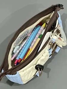 Detailed view of multi-functional canvas pencil case interior storage compartment capacity.