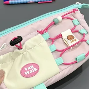 Cute cartoon multi-functional canvas pencil pouch with large capacity for students and office use.