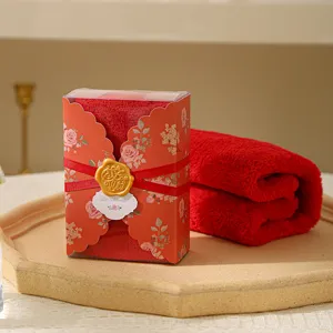 Red coral fleece towel gift box with floral packaging and ribbon for wedding favor.