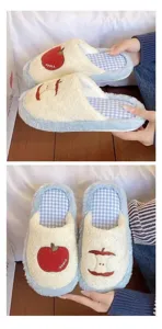 Cute red apple plush slippers for winter warmth, comfortable fuzzy home shoes with plaid lining.