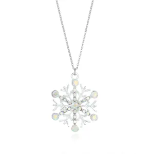 Close-up of a silver snowflake necklace with iridescent rhinestones on a white background.