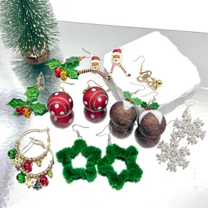 Detail view of various festive Christmas earrings featuring Santa, snowflakes, and bells.
